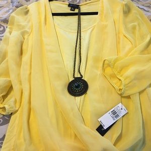 Yellow half sheer blouse with necklace